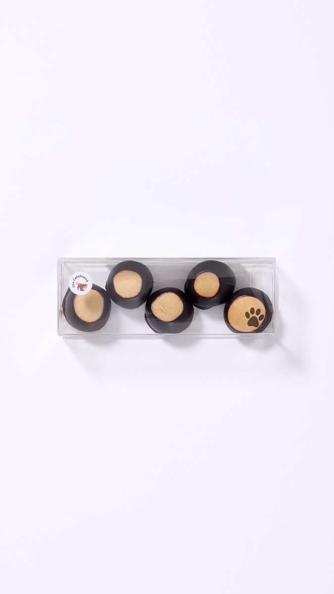 A tray of freshly handcrafted buckeye confections — peanut butter dipped in rich chocolate